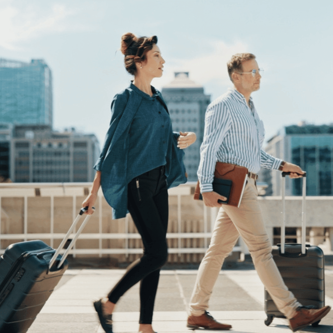 Business travelers with their luggage